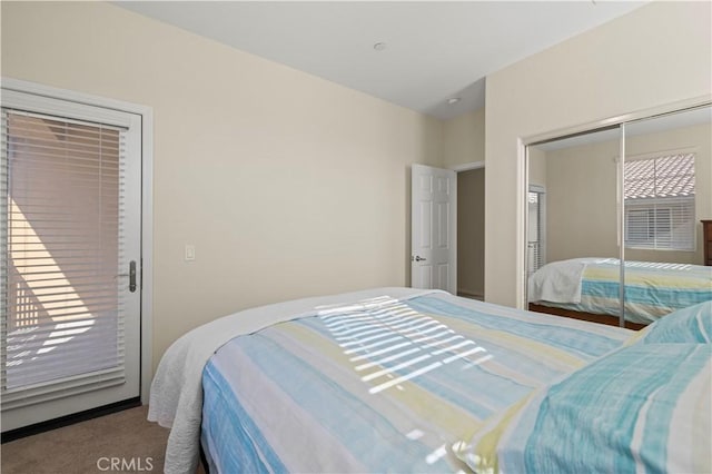 carpeted bedroom featuring a closet