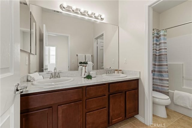 full bath featuring a sink, visible vents, toilet, and tile patterned floors