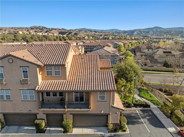 aerial view featuring a mountain view and a residential view