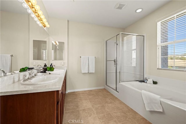 bathroom featuring a stall shower, a sink, tile patterned flooring, double vanity, and a bath