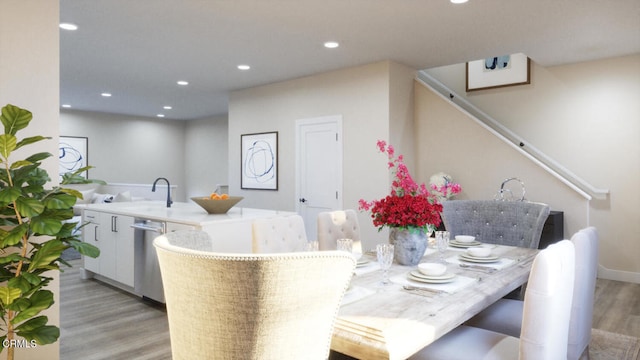 dining space featuring recessed lighting and light wood finished floors