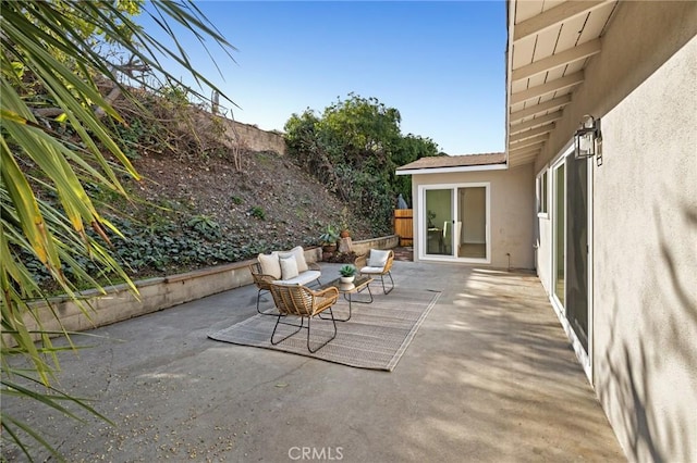 view of patio / terrace featuring fence