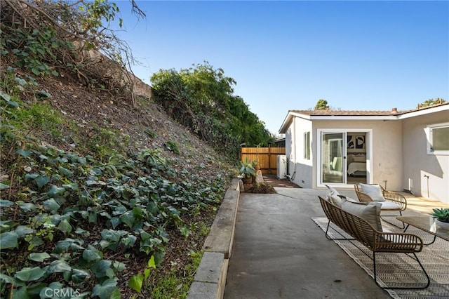 view of patio featuring fence