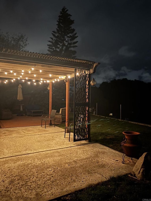 patio at night with a pergola