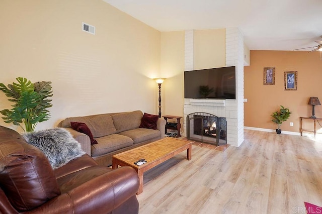 358 Mainsail Rd, Oceanside, CA 92054 - living area with a brick fireplace, light wood finished floors, and a ceiling fan
