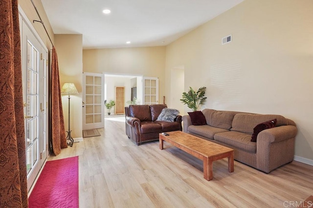 358 Mainsail Rd, Oceanside, CA 92054 - living room featuring lofted ceiling, light wood-style floors, french doors, and recessed lighting