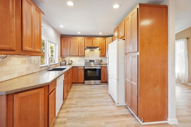 358 Mainsail Rd, Oceanside, CA 92054 - kitchen featuring white appliances, under cabinet range hood, light wood finished floors, decorative backsplash, and recessed lighting