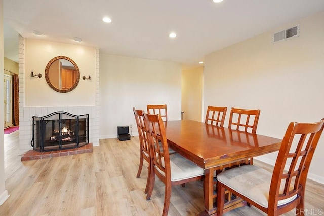 358 Mainsail Rd, Oceanside, CA 92054 - dining area featuring light wood-type flooring, recessed lighting, and a brick fireplace