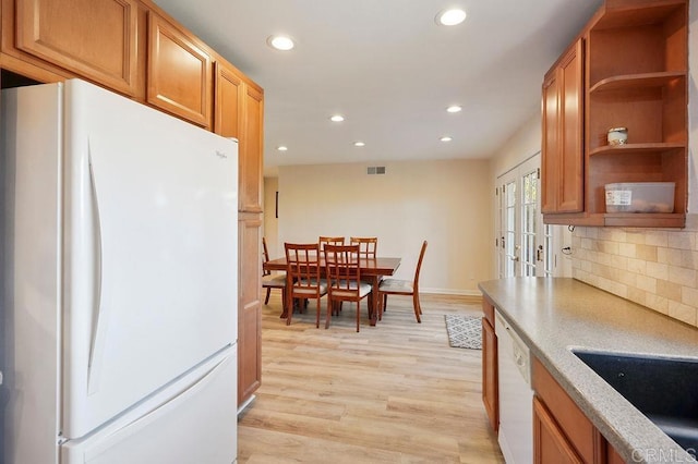 358 Mainsail Rd, Oceanside, CA 92054 - kitchen with white appliances, recessed lighting, decorative backsplash, light countertops, and light wood-style flooring