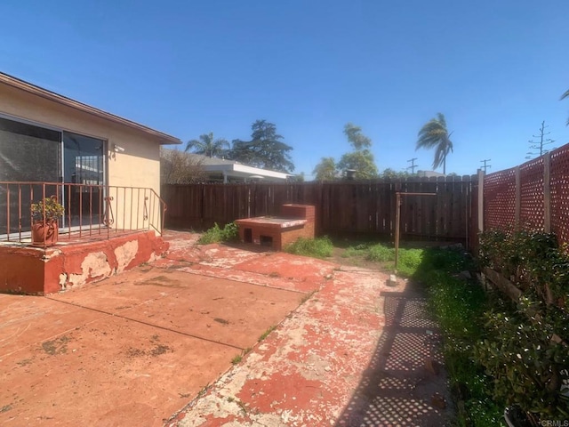 view of yard with a fenced backyard and a patio