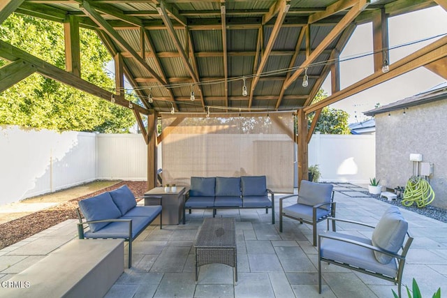 view of patio with an outdoor living space and a fenced backyard