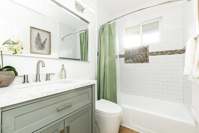 full bath featuring shower / tub combo, toilet, and vanity