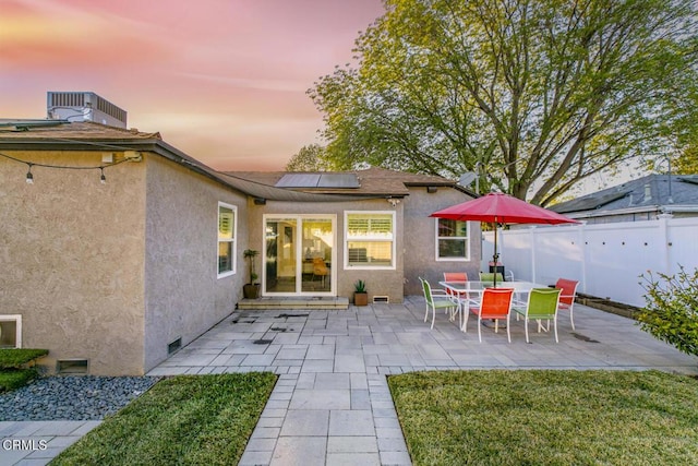 back of property featuring stucco siding, a patio, cooling unit, and fence