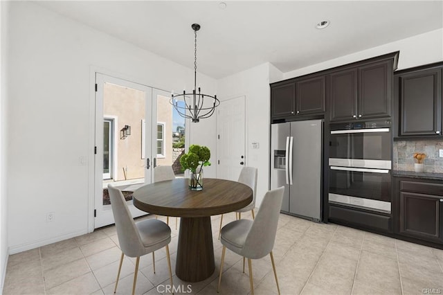 dining area featuring recessed lighting, french doors, light tile patterned flooring, baseboards, and a chandelier