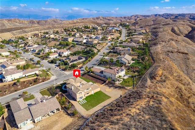 birds eye view of property with a mountain view and a residential view