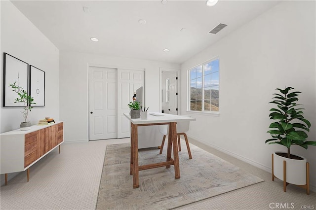 office featuring recessed lighting, visible vents, light carpet, and baseboards