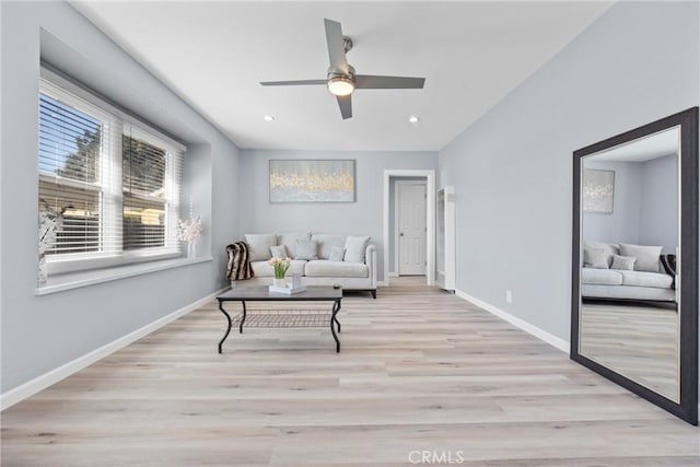 living area with recessed lighting, a ceiling fan, baseboards, and wood finished floors