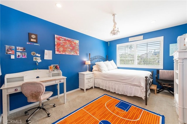 bedroom with baseboards and carpet