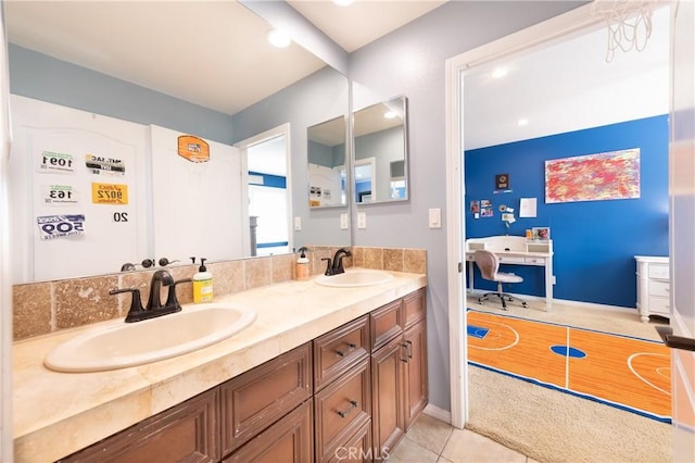 bathroom featuring a sink, double vanity, and tile patterned flooring