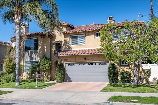 mediterranean / spanish-style home with a tile roof, an attached garage, driveway, and stucco siding