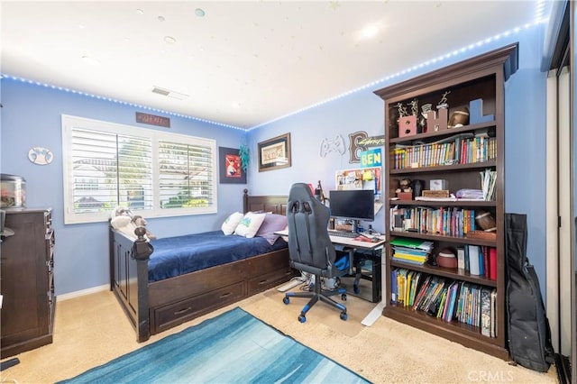 carpeted bedroom with baseboards and visible vents