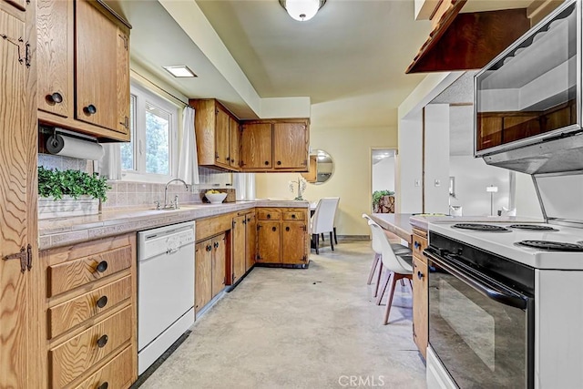 kitchen with brown cabinets, range with electric cooktop, dishwasher, and light countertops