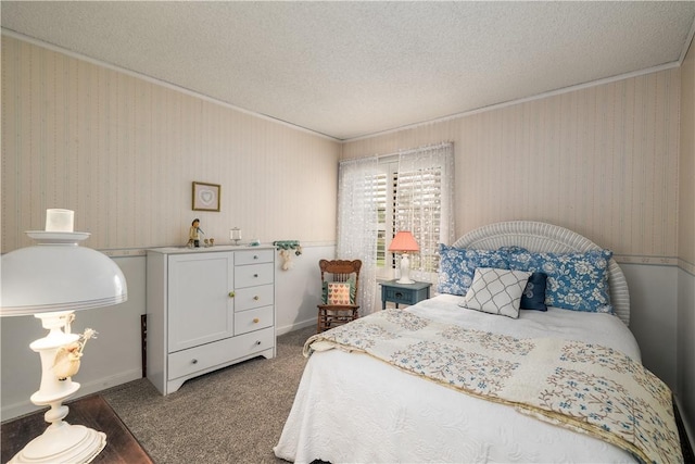 bedroom with carpet, baseboards, wallpapered walls, a textured ceiling, and crown molding