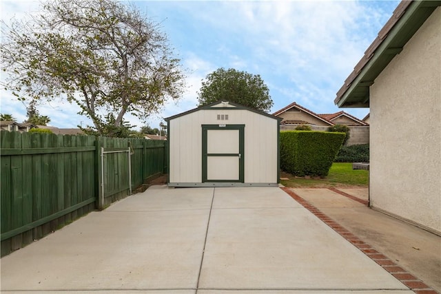 view of shed featuring a fenced backyard