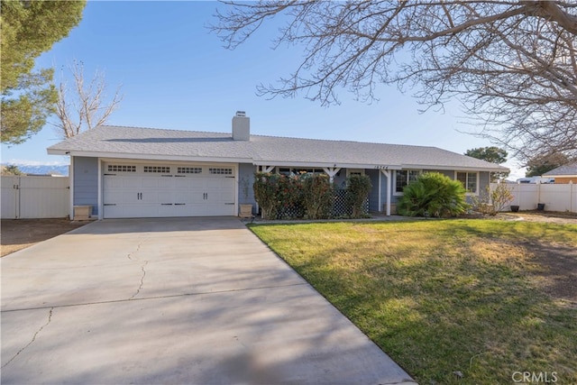 ranch-style house featuring an attached garage, driveway, a front lawn, and fence