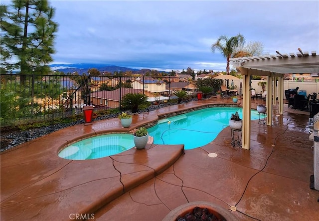 view of swimming pool with an in ground hot tub, a pergola, a patio, and fence