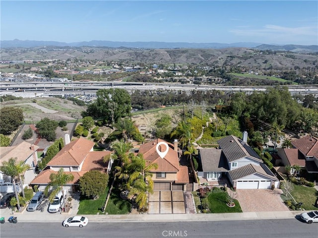 aerial view featuring a mountain view and a residential view