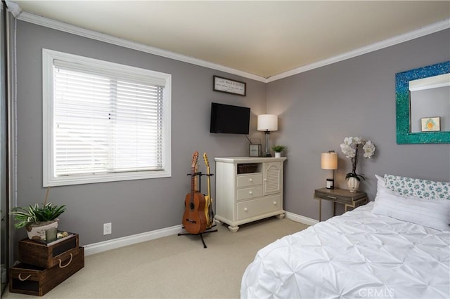 carpeted bedroom with crown molding and baseboards