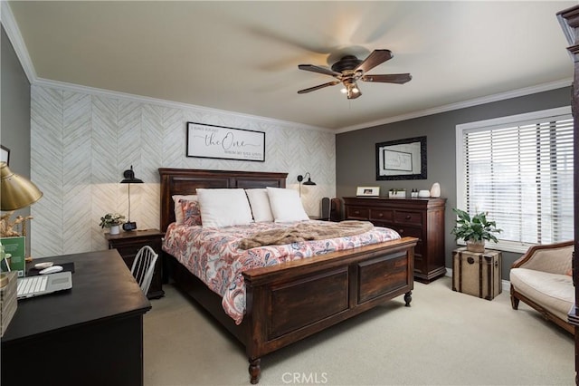 bedroom with a ceiling fan, baseboards, ornamental molding, light carpet, and an accent wall