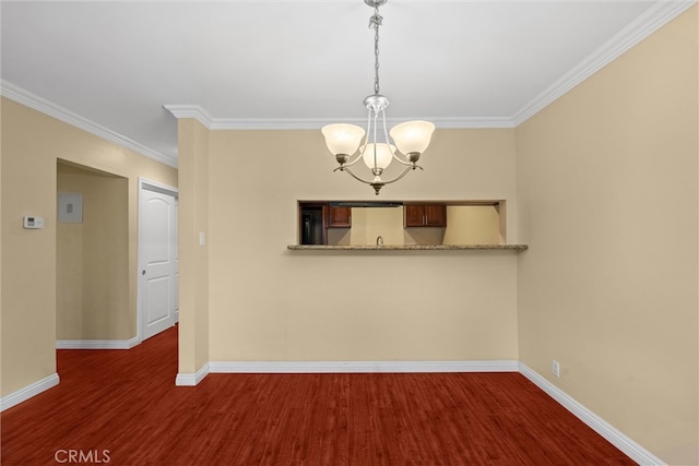 empty room featuring baseboards, a chandelier, dark wood-style flooring, and ornamental molding