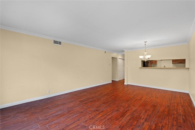 unfurnished living room featuring visible vents, crown molding, baseboards, a chandelier, and wood finished floors