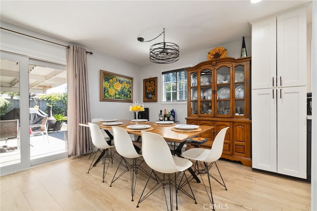 dining space featuring light wood-style flooring