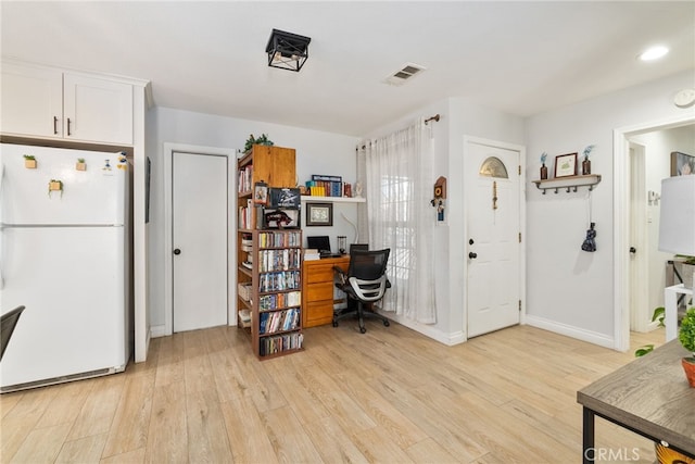 home office with recessed lighting, visible vents, baseboards, and light wood finished floors