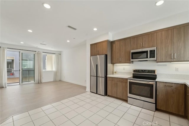 kitchen with light countertops, recessed lighting, visible vents, and stainless steel appliances