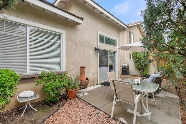 view of patio / terrace with a grill and outdoor dining area