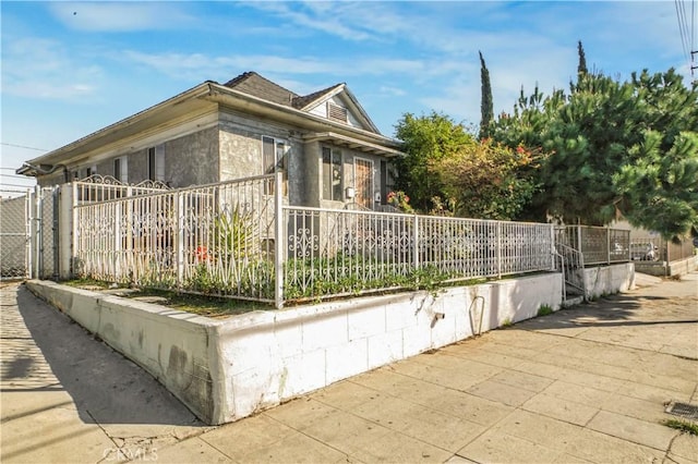 view of home's exterior featuring fence