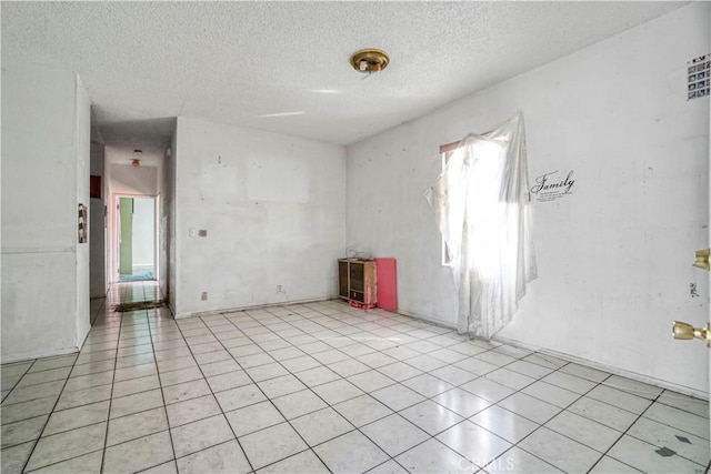 empty room with a textured ceiling