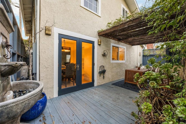 wooden deck featuring french doors