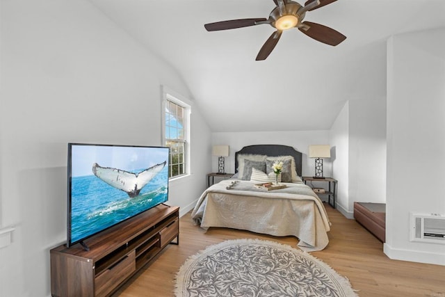 bedroom with vaulted ceiling, a ceiling fan, baseboards, and wood finished floors