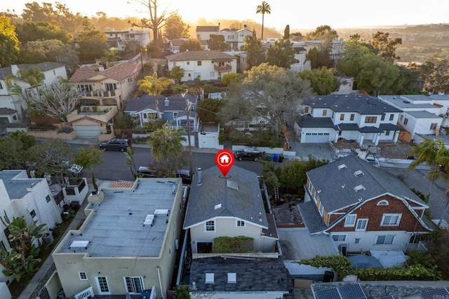 birds eye view of property with a residential view