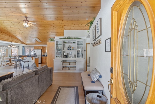 living room featuring high vaulted ceiling, ceiling fan with notable chandelier, wood ceiling, and light wood-type flooring