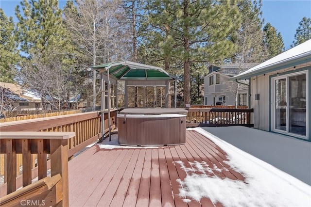 wooden deck with a hot tub