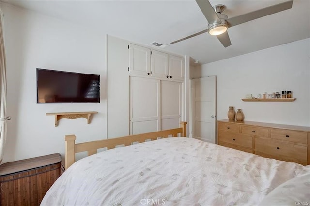 bedroom featuring visible vents and ceiling fan