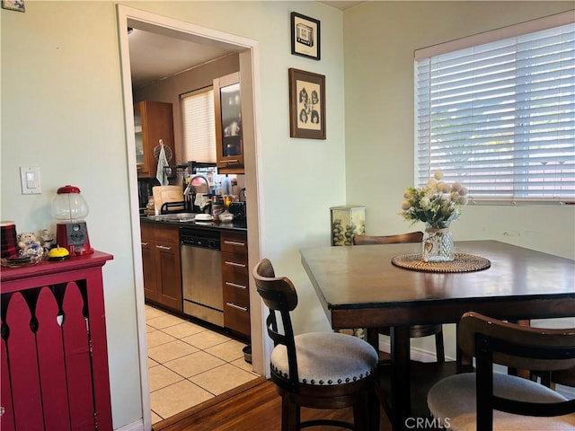 dining area with light tile patterned flooring