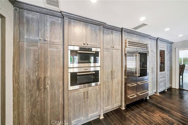 5441 Calvin Ave, Tarzana, CA 91356 - kitchen with visible vents, dark wood finished floors, recessed lighting, and stainless steel appliances
