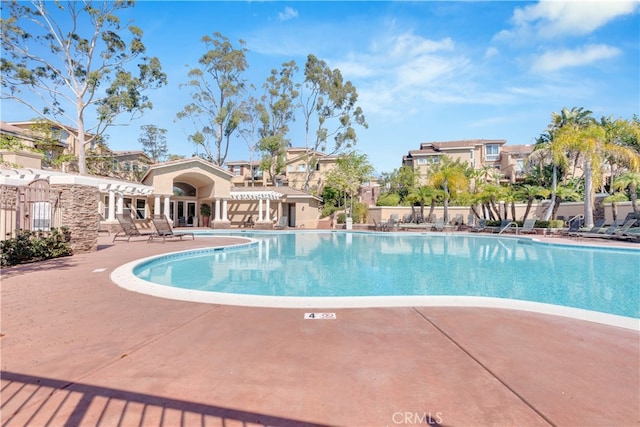 pool with a patio area